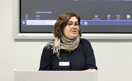 Dr Tugba Basaran, Director of the Centre for the Study of Global Human Movement and Founder of the Cambridge Refugee Hub, giving the opening speech at Cambridge Refugee Week 2024. 