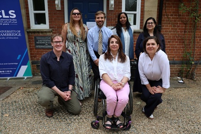 A photo of several of the people involved in organising Cambridge Refugee Week 2025, standing as a group outside the Lauterpacht Centre for International Law.