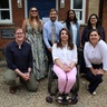 A photo of several of the people involved in organising Cambridge Refugee Week 2025, standing as a group outside the Lauterpacht Centre for International Law.